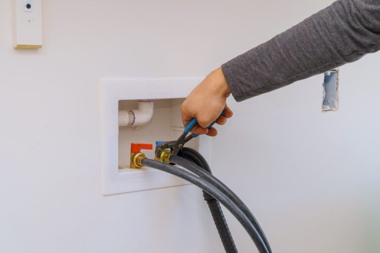 Plumber Installation Hoses for to washing machine using wrench